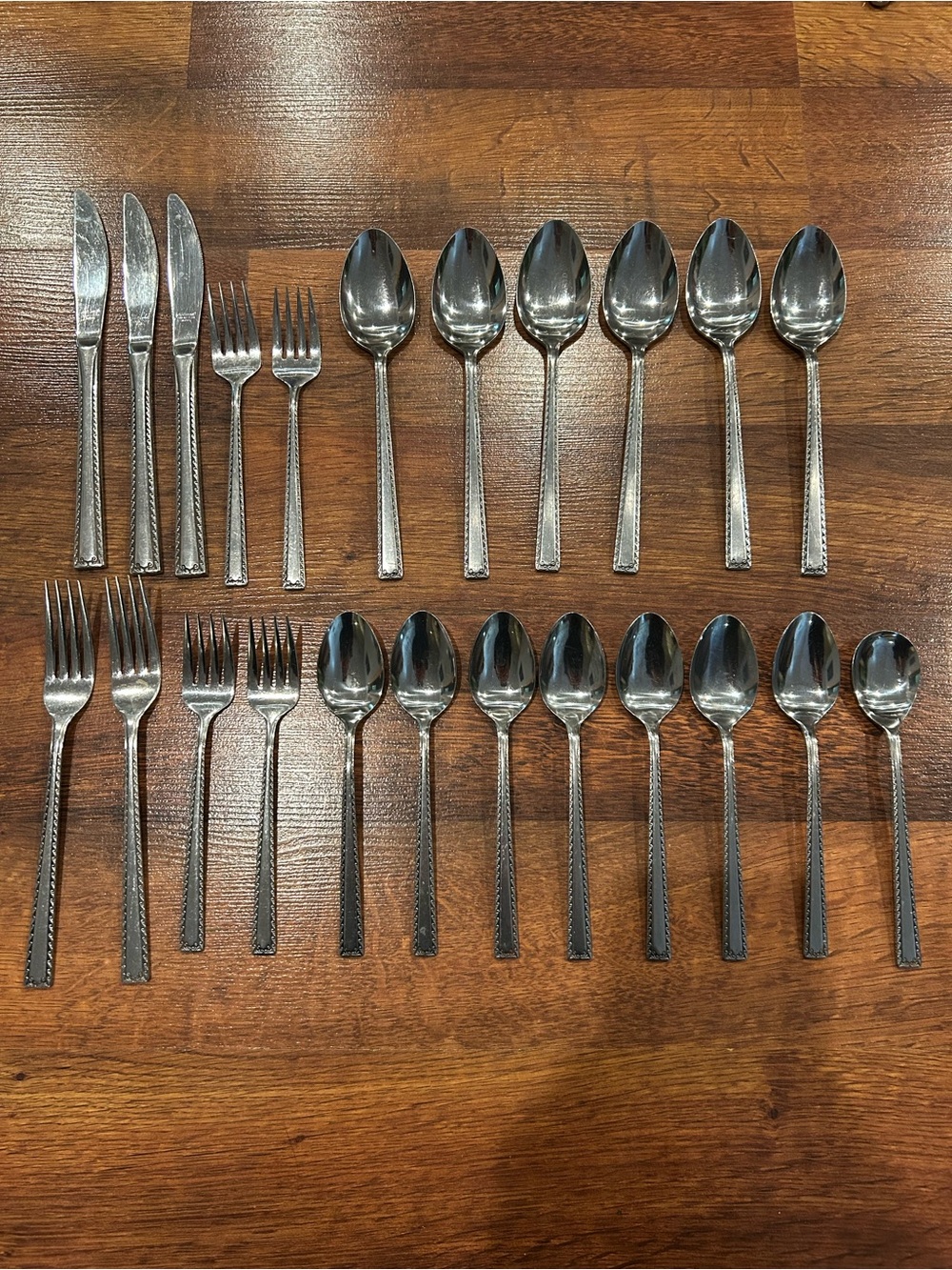 National Stainless Bell Wood Pattern
Scroll Edge 23 Piece Flatware